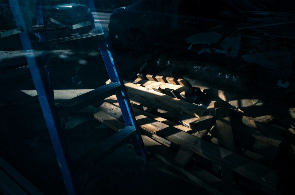 black and white shoes on brown wooden rack