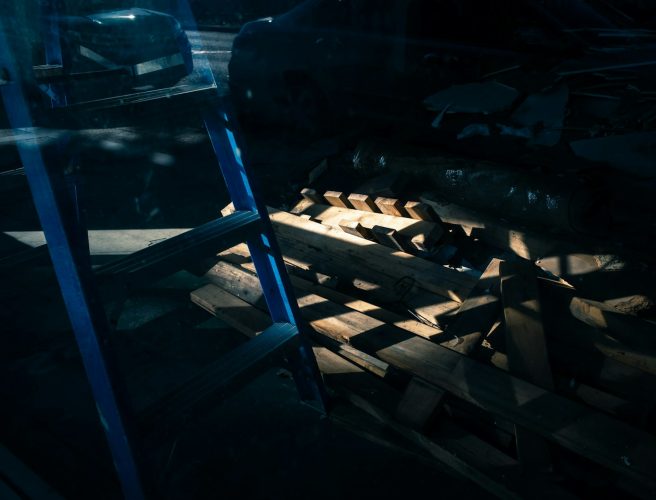 black and white shoes on brown wooden rack